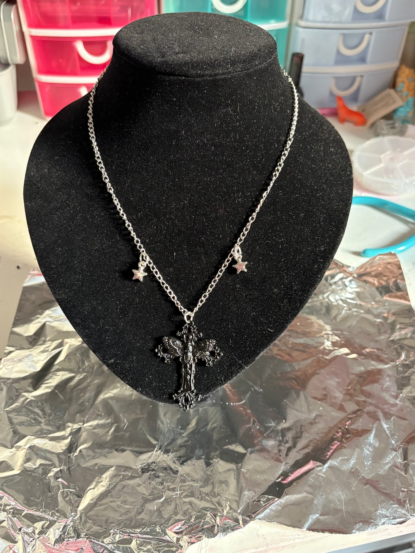 Black cross with stars necklace