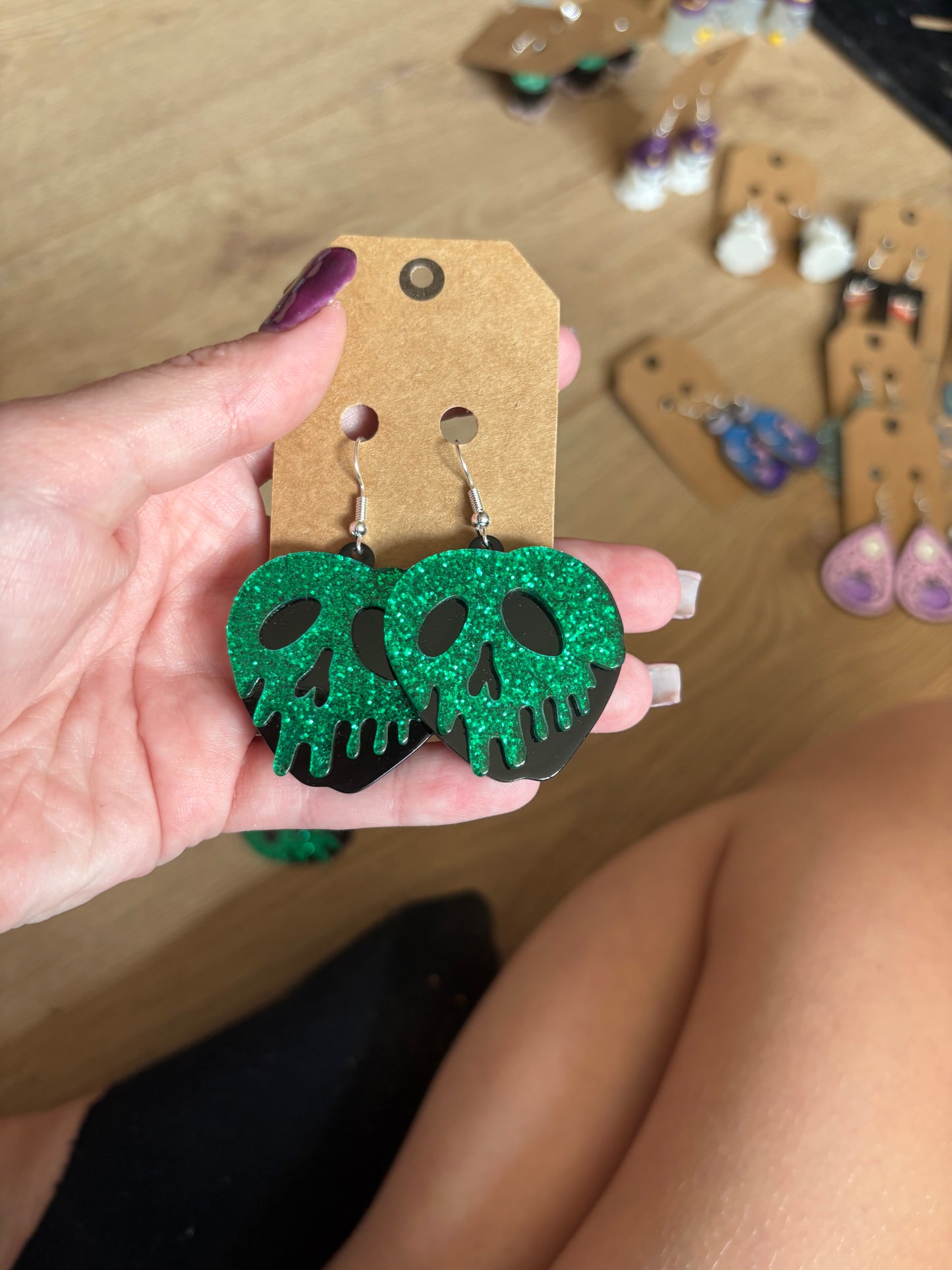 Green skull earrings