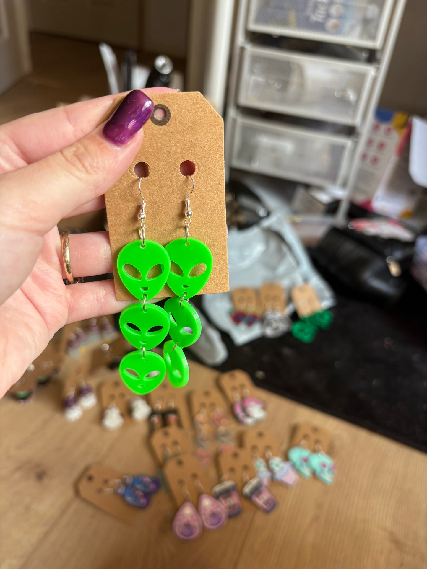 Neon green alien earrings