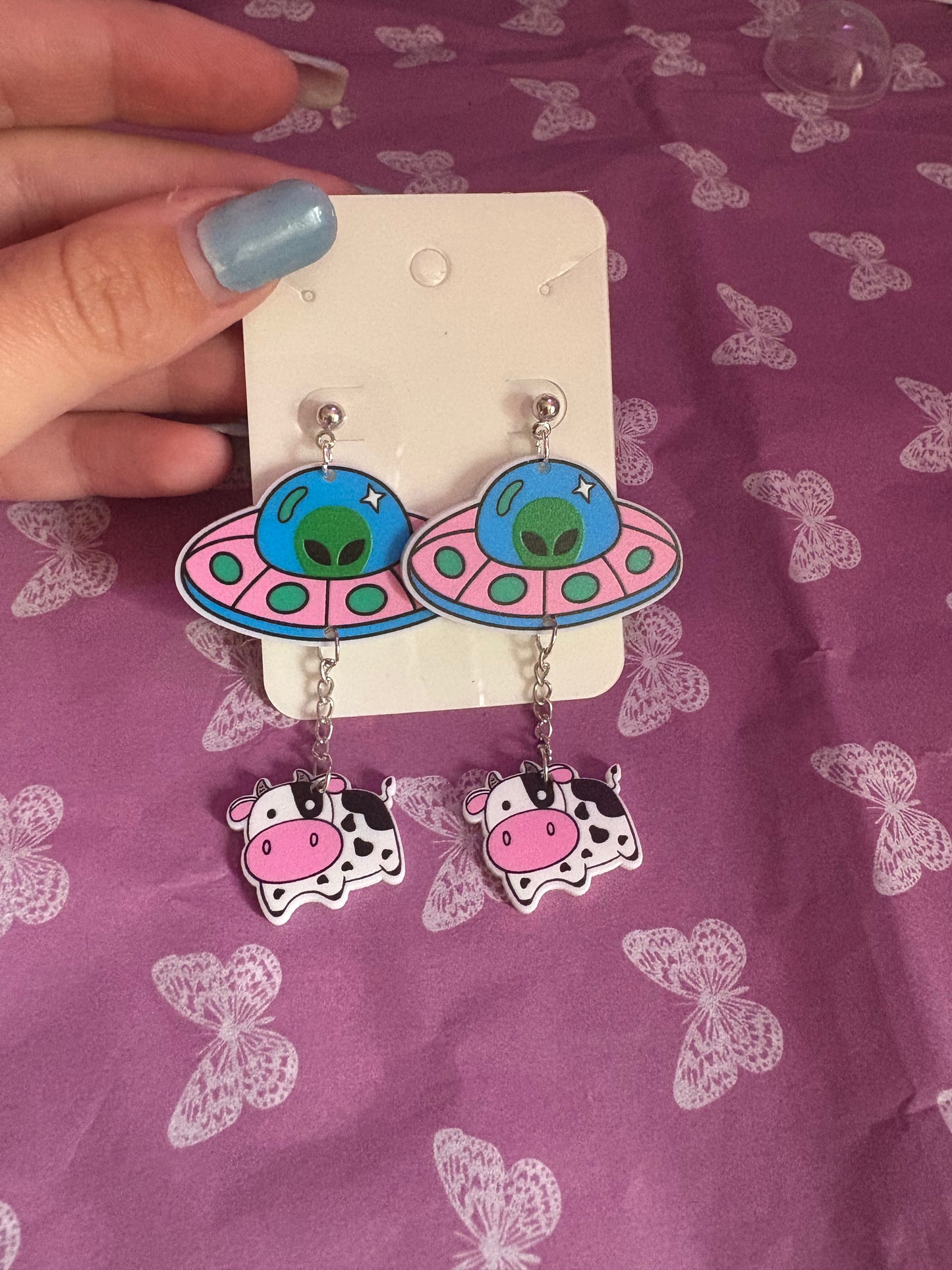 Spaceship with cow earrings