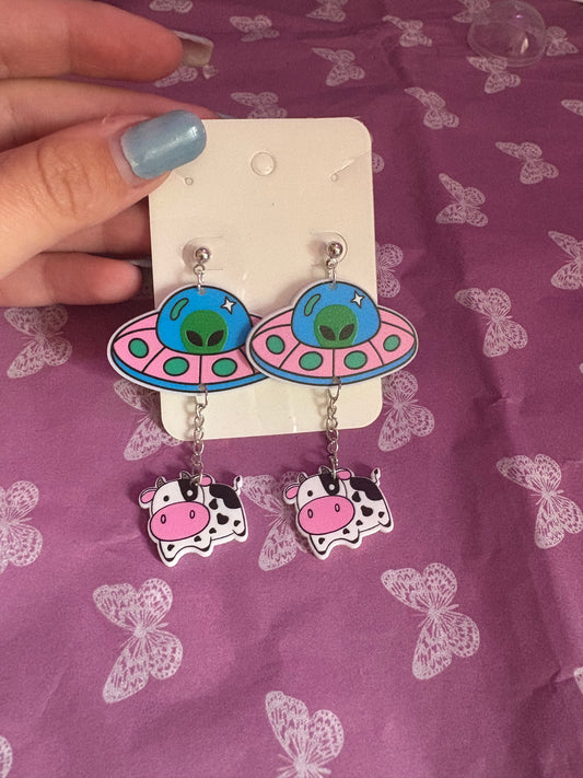 Spaceship with cow earrings